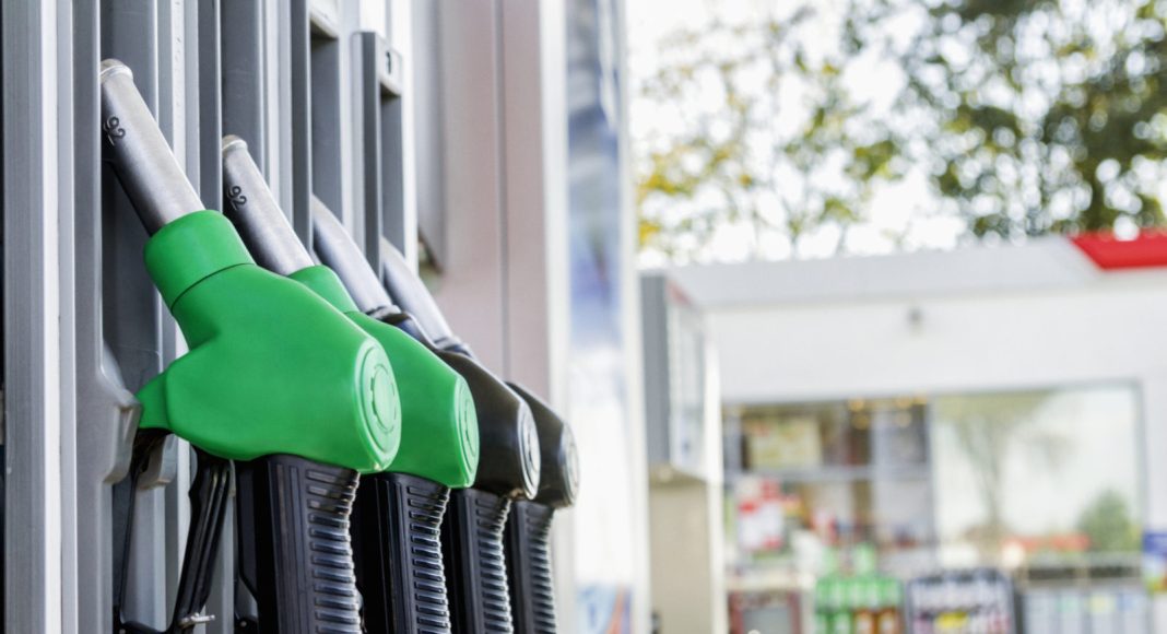 Gasoline and diesel distributor at the gas station. Gas pump nozzles.